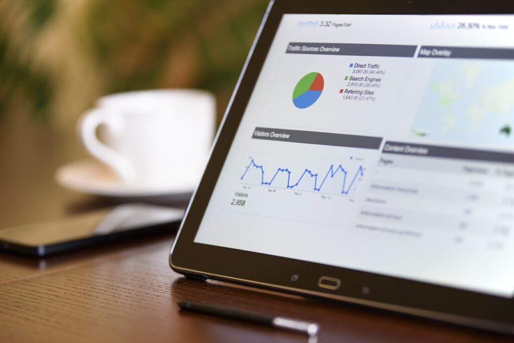 Image of a tablet that shows data in a pie chart and line chart.