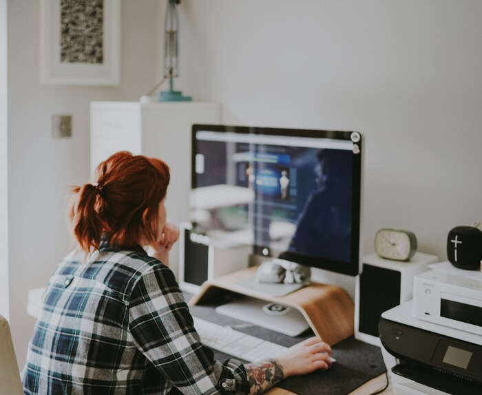 Image of a woman working at her computer.