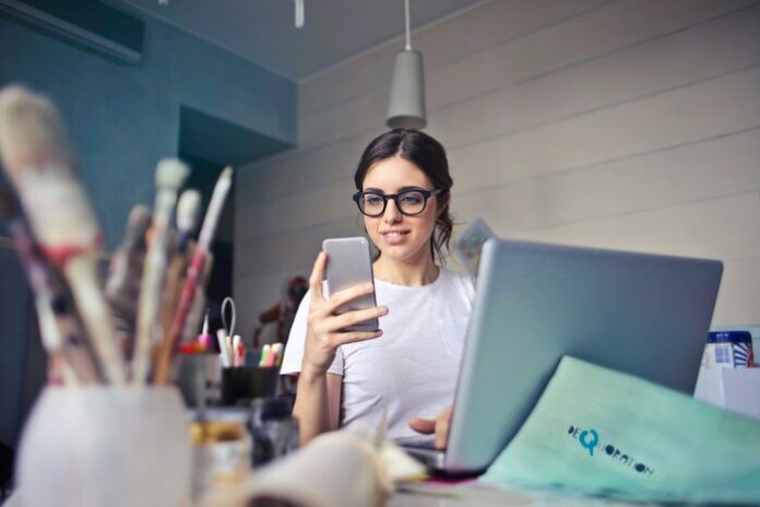 Image of a woman working and on her laptop.