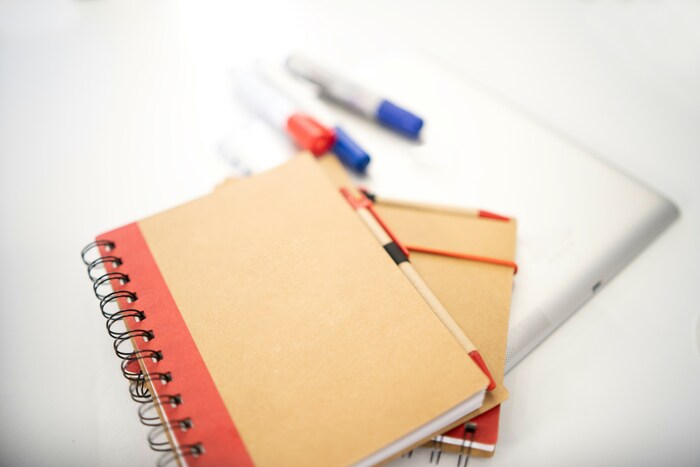 Image of markets, notebooks, and pens.