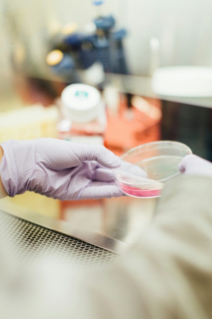 Image of a healthcare worker holding a petri dish.