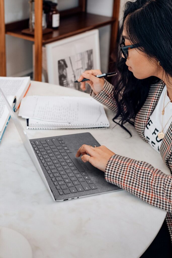 Image of a young woman studying for college.